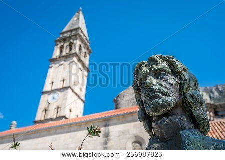 Tripo Rorolja Statue In Front Of The Saint Nikola Church Tower In Perast, Kotor Harbor, Montenegro