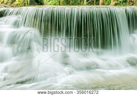 Travel To The Beautiful Waterfall In Tropical Rain Forest, Soft Water Of The Stream In The Natural P