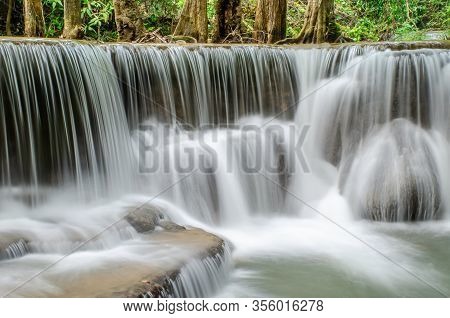 Travel To The Beautiful Waterfall In Tropical Rain Forest, Soft Water Of The Stream In The Natural P