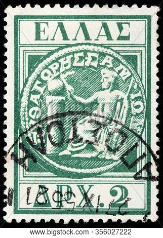 Luga, Russia - October 15, 2019: A Stamp Printed By Greece Shows Samian Coin With Portrait Of Ancien