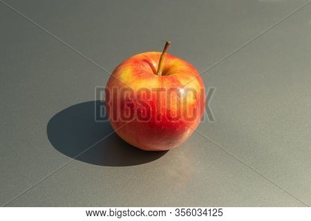 Juicy Ripe Apple Fruits On A Gray Background