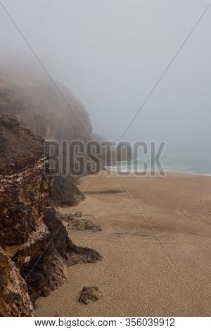 Sea And Sandy Beach In Dense Fog, Autumn Day