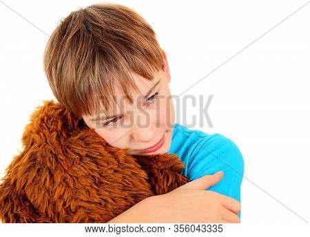 Sad Boy With A Plush Toy On The White Background