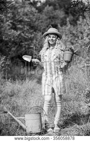 Small Girl Farmer Care Plant In Pot. Farming And Agriculture. Spring Season. Hellow Summer. Small Gi