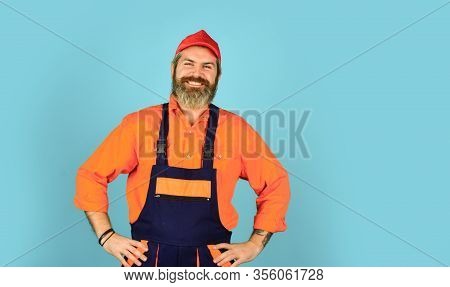 Engineer And Industrial Building. Repair Advertisement. Builder Or Plasterer. Mature Repairman In Un