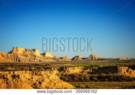 Bardenas Reales is a Spanish natural park of wild beauty, it is a semi-desert landscape in which erosion has carved whimsical shapes to create almost lunar effects with badlands and lonely hills