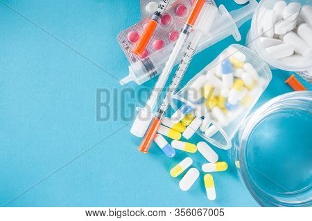Pharmaceutical Medicine Pills Concept, Assorted Various Pills, Tablets And Capsules With Medical Syr
