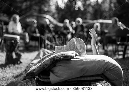 An Atmospheric Selective Focus Black And White View From Behind An Old Man At His Farewell Party Dur