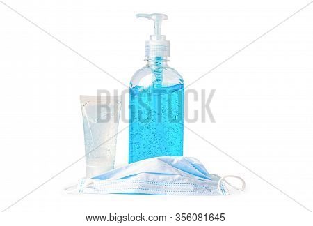 A Bottle Of Blue Alcohol Sanitizer Gel And Mask On White Background For Protect Infection And Kill N