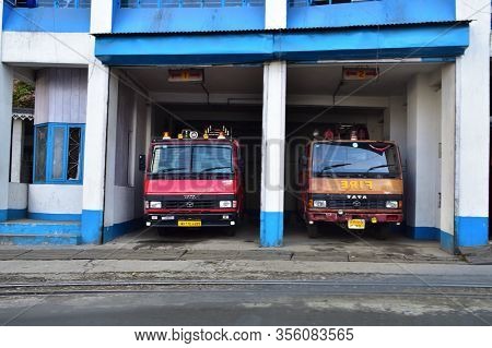 Ghoom, West Bengal, India- December 27, 2019: Red And White Fire Trucks Ready For Action On A High F