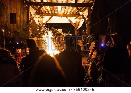 View From The Crowd Of Young Male Singing With A Northern Australian Wind Musical Instrument Called 