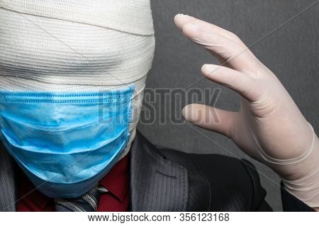 Incognito Man In A Medical Mask Is Dressed In A Business Suit
