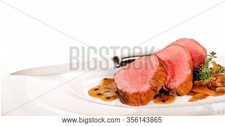 Roasted Beef Steak With Sauce And Vegetables