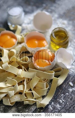 The Concept Of Cooking Egg Noodles. Raw Noodles, Eggs, Flour. Egg Noodles.