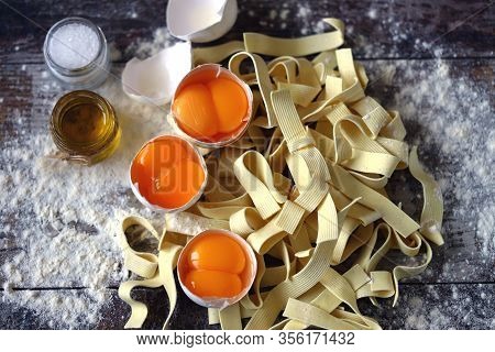 The Concept Of Cooking Egg Noodles. Raw Noodles, Eggs, Flour. Egg Noodles.