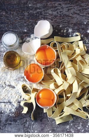 The Concept Of Cooking Egg Noodles. Raw Noodles, Eggs, Flour. Egg Noodles.
