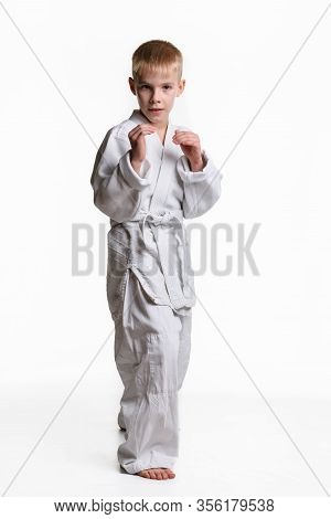 A Boy Stands In A Rack, Studying Martial Arts