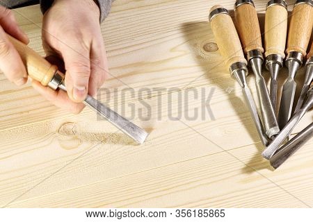 Chisels. Assortment Of Chisel Of Wood For Carpentry. Hand Holding Chisel.