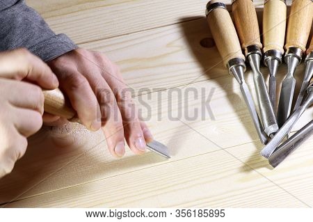 Chisels. Assortment Of Chisel Of Wood For Carpentry. Hand Holding Chisel.