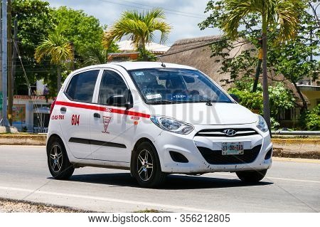 Tulum, Mexico - May 17, 2017: White Taxi Car Hyundai I10 In The City Street.