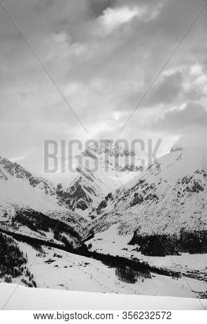 Snowy Ski Slope In High Mountains And Cloudy Sunlit Sky At Winter Evening. Ski Area Mottolino Fun Mo