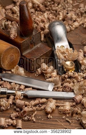 Chisel And Small Block Plane With Wood Shavings