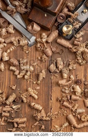 Chisel And Small Block Plane With Wood Shavings