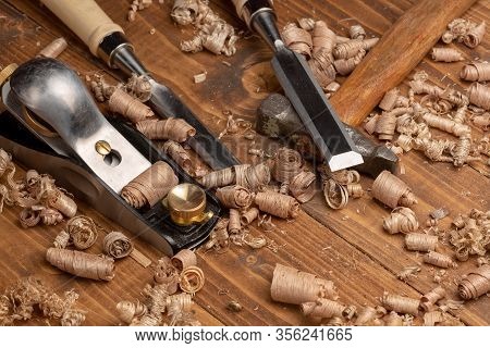 Chisel And Small Block Plane With Wood Shavings