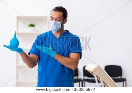 Young male doctor working in the clinic