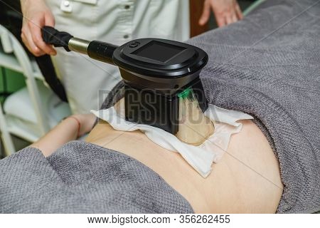 Woman Getting Cryolipolysis Fat Treatment Procedure In Beauty Salon