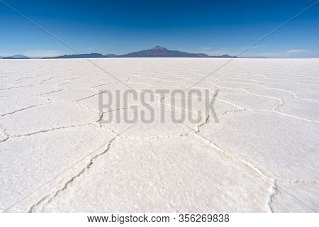 Famous Salar De Uyuni Salts With Tunupa Volcano On Horizon