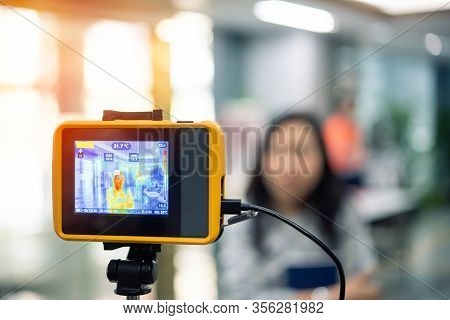 People Waiting For Temperature Check By Thermoscan