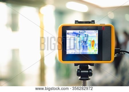 People Waiting For Temperature Check By Thermoscan