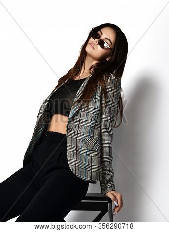Stylish Sexy Brunette Woman In Modern Office Pantsuit Checkered Jacket, Black Trousers And Stylish N
