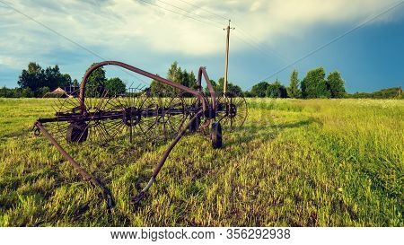 An Old Sweeper. Old Agricultural Equipment. Making Hay Drying And Turning The Hay