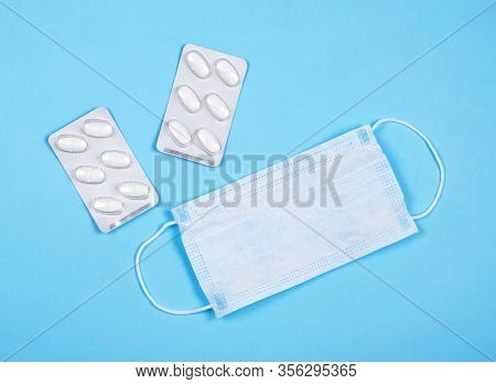 P Revention Of C Oronavirus. Medical Masks, Vitamins On A Blue Background.