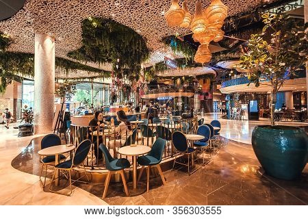 Bangkok, Thailand: Some Women Chatting And Drinking Coffee In Luxury Hall Of Urban Shopping Mall Wit