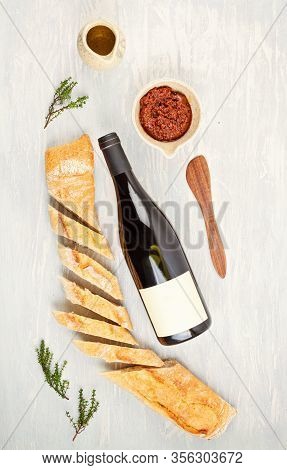 Bottle Of Red Wine, Bread And Tomatoes For Buffet Party. Traditional French Or Italian Entires Flat 