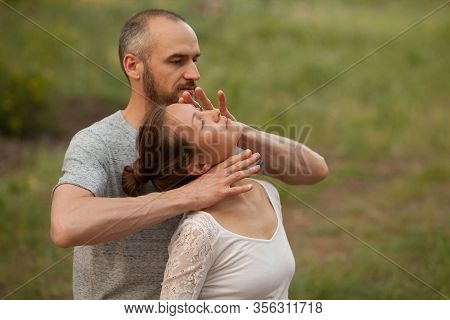 Yumeiho Massage Therapy. Masseur Young Man Doing Oriental Japanese Massage Yumeiho Girl. Concept Of 
