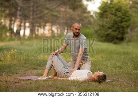 Yumeiho Massage Therapy. Masseur Young Man Doing Oriental Japanese Massage Yumeiho Girl. Concept Of 
