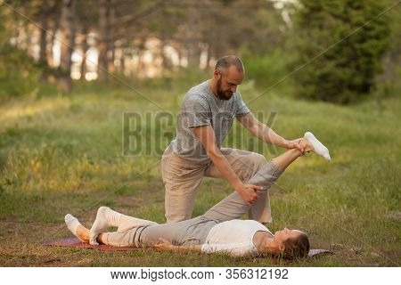 Yumeiho Massage Therapy. Masseur Young Man Doing Oriental Japanese Massage Yumeiho Girl. Concept Of 