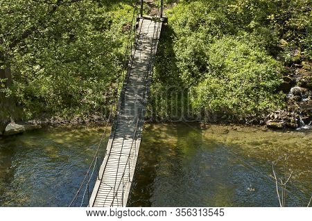 Old Suspension Bridge Over River Vit In The Springtime Near Teteven Town, Bulgaria