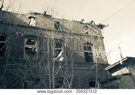 A Crumbling House, A Dilapidated Dwelling As A Symbol Of Economic Insecurity. Unrepaired After A Fir