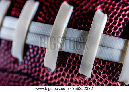 Plastic Laces On Red And Black Football Conceptual Image