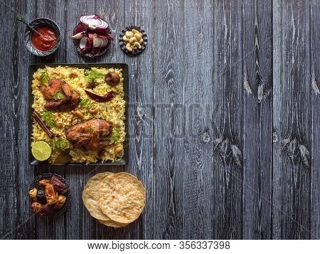 Arab- Mandi Rice. Yemenis Style. Festive Dish With Baked Chicken And Rice. Top View, Copy Space.