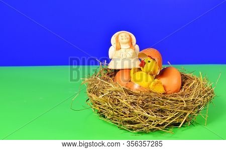 In A Straw Nest, Surrounded By An Angel, A Chicken Hatched From An Egg