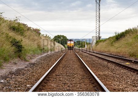 Scotby, England - July 17:  A Diesel Train On A Railway Track In Northern England Is Pictured On Jul