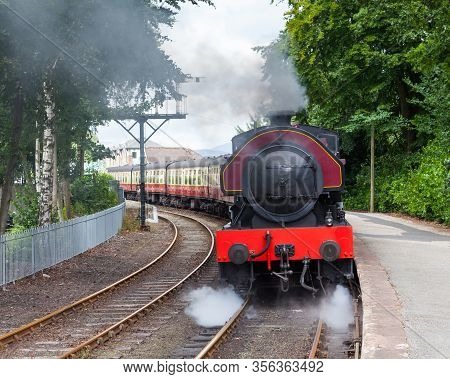 Lakeside, England - August 8:  Victor, A Preserved Steam Locomotive, Departs Lakeside Station On Aug