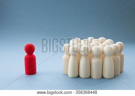 A Concept Image Of A Person Standing Out From A Crowd As A Leader Or Inspirational Teacher Amongst M