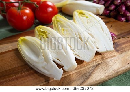 Fresh Belgian Endive Or Chicory Bitter Salad Ready To Cook Or Eat
